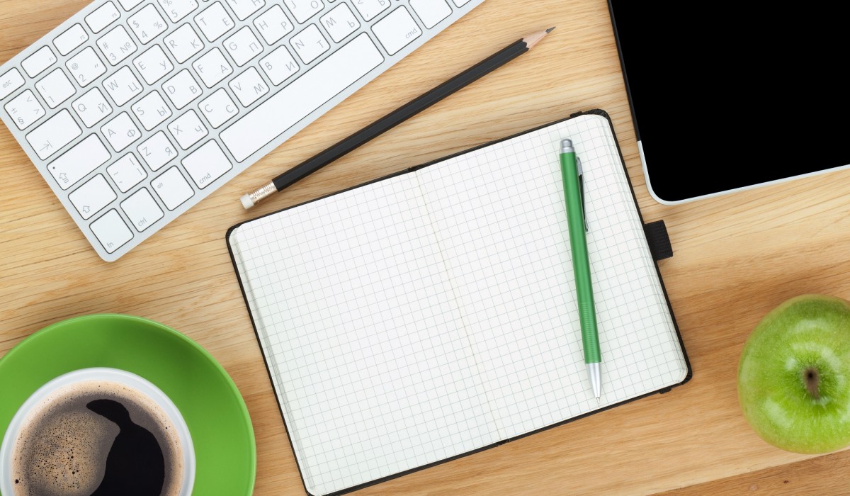 desk aerial view - keyboard, green, coffee, notepad -1200x700.jpg